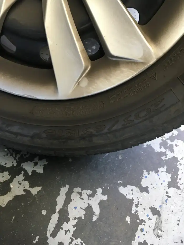 Tire sidewall showing size 205/65R16 on a 2013 Hyundai Sonata during a digital vehicle inspection in San Mateo